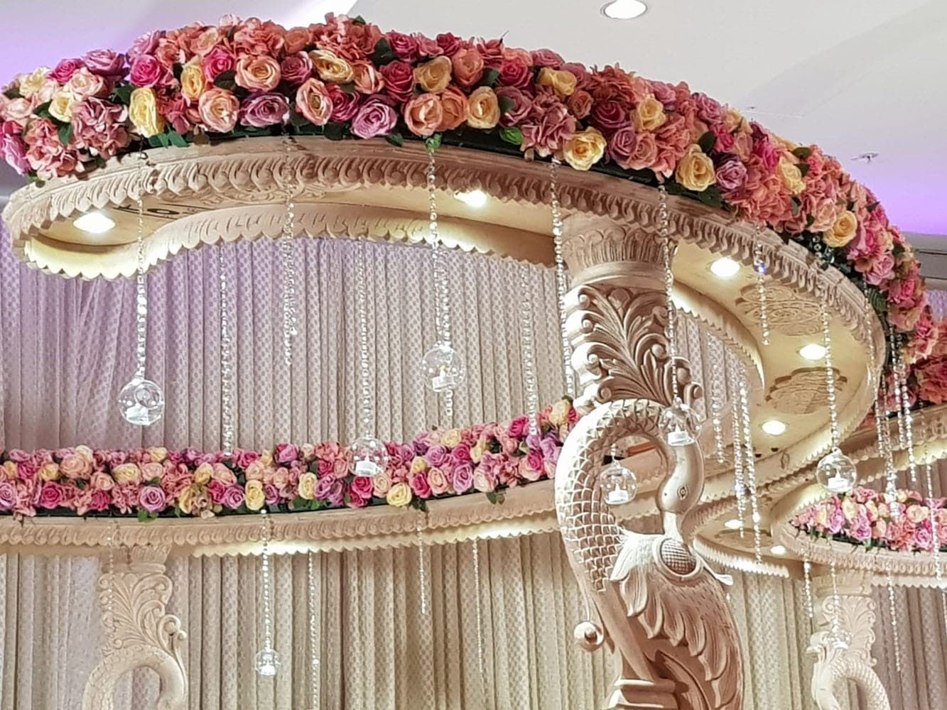 Peacock carved two-tier canopy with roses, crystal strands and glass globes Peacock carved two-tier canopy with roses, crystal strands and glass globes